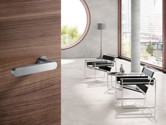 HEWI door handle series 270 mini Door leading into a living room, fitted with Series 270 mini lever handle