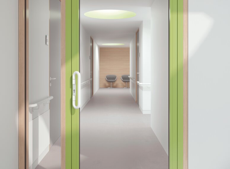 HEWI Drückergriff Signalweiß Verglaste Krankenhaustür mit grünem Rahmen ausgestattet mit einem Drückergriff in der Farbe Signalweiß aus Polyamid