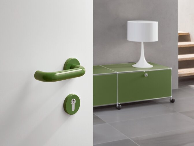 HEWI lever handle 111 May green White hallway door fitted with a lever handle in the colour may green